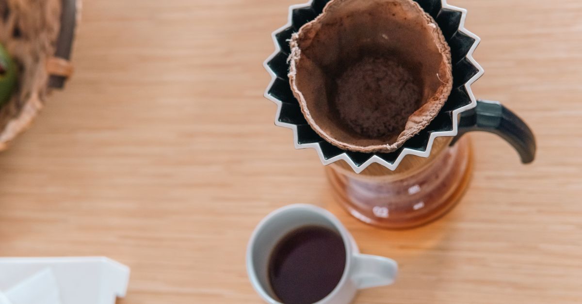 Overhead view of a coffee cup and cloth filter, showcasing hario pour-over method.