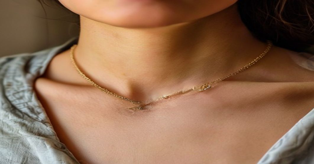 close up of necklace worn at collarbone